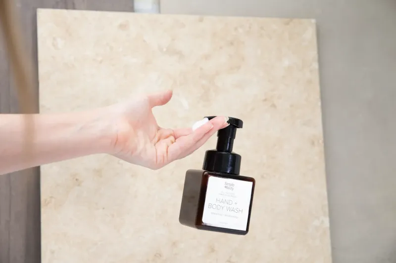 Wide lifestyle photography showing natural skincare products in daily use