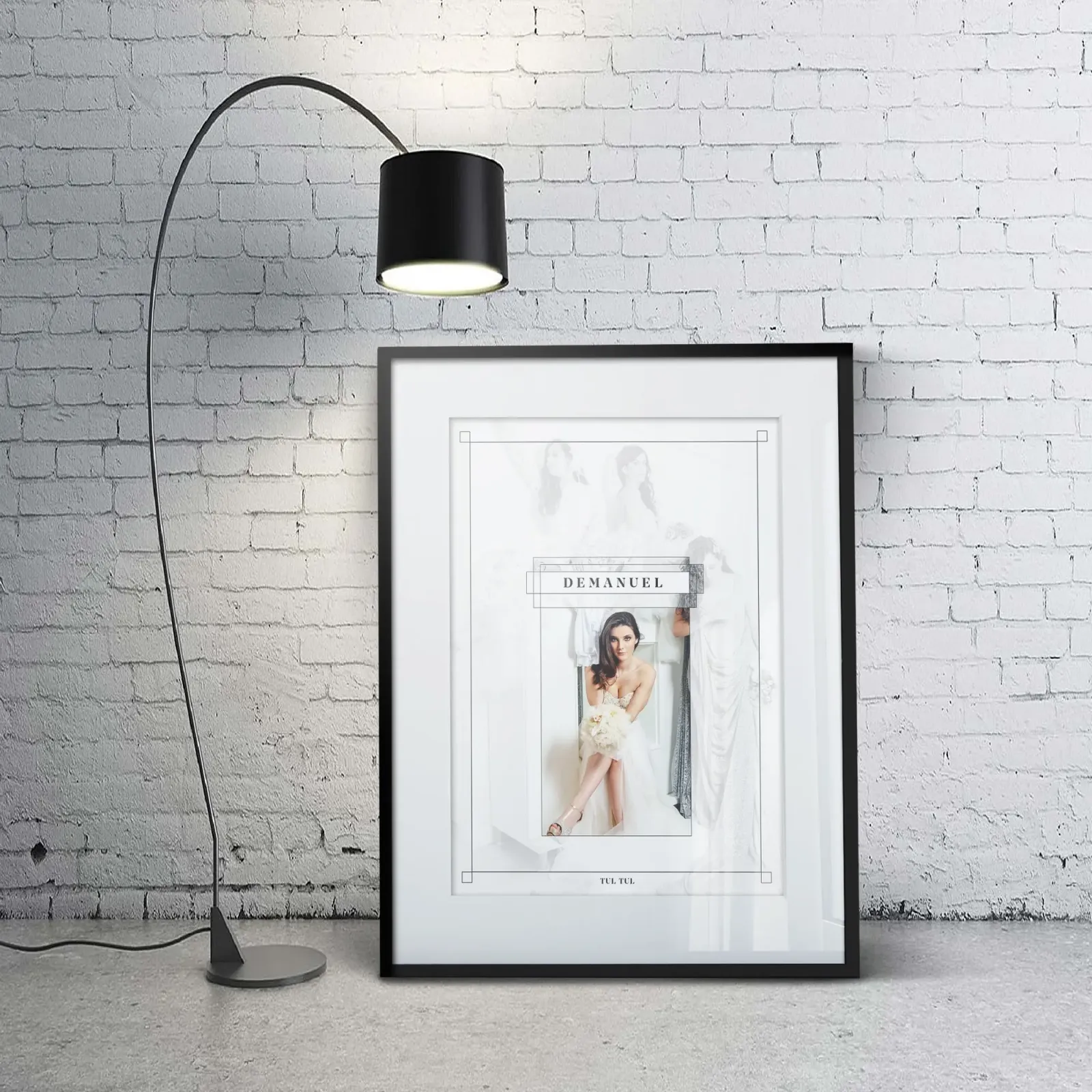 Demanuel TUL TUL brand poster mockup showing serif wordmark logo framing an editorial bridal photograph in a black portrait frame against white brick wall