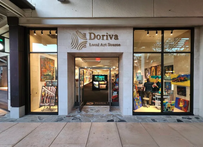 Doriva Local Art Source gallery storefront in San Antonio with stone facade branded signage and colorful original artwork visible in large windows